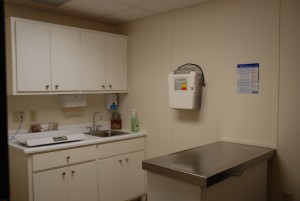 A kitchen with a sink and counter in it