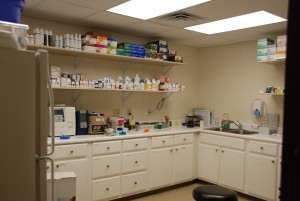 A room with many different items on the shelves.